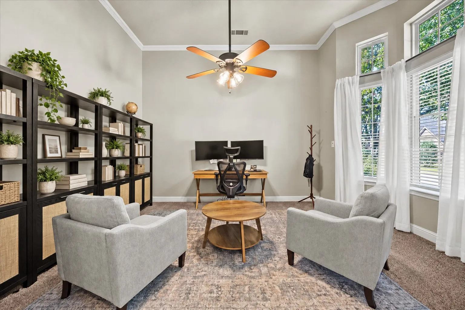 1602 Mapleleaf Drive, Wylie Tx Vaulted ceiling with crown molding, ceiling fan with integrated lighting, built-in shelving, and large windows with transom panels