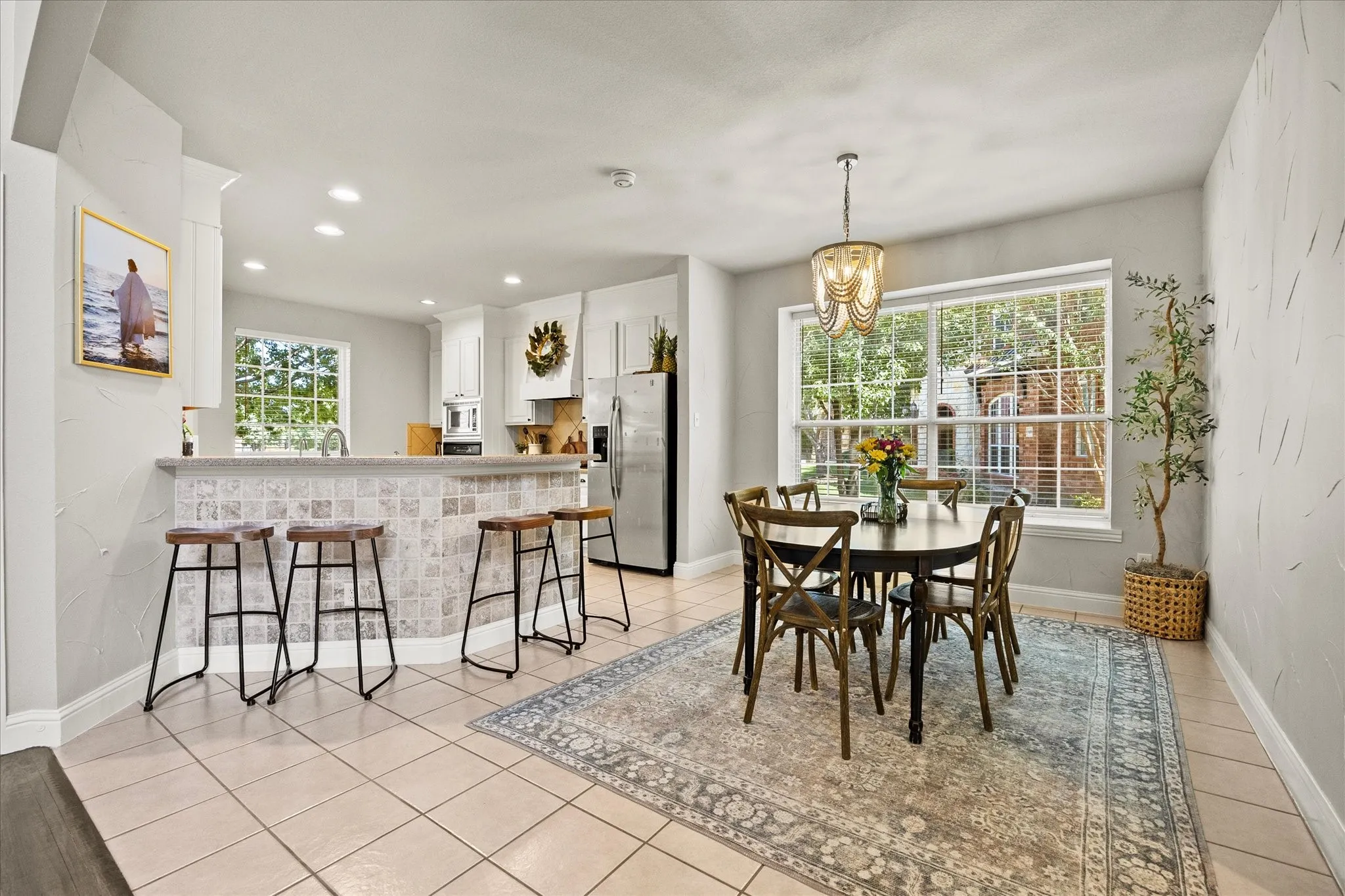 1602 Mapleleaf Drive Wylie, TX 75098 Tile flooring with an integrated kitchen and dining space