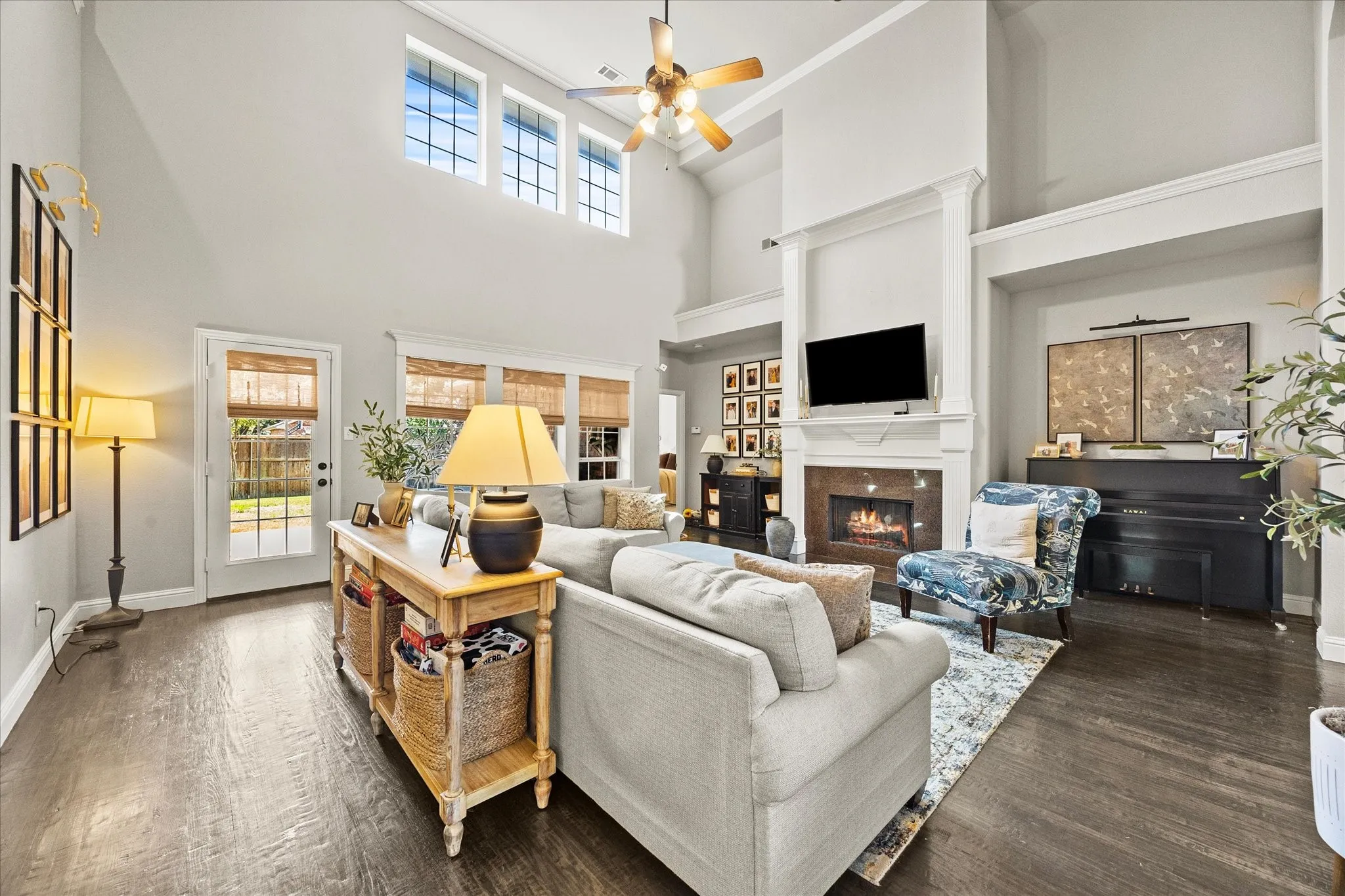 1602 Mapleleaf Drive Wylie, TX 75098 Vaulted ceiling with transom windows, wood-finish flooring, fireplace with mantel, and recessed ceiling lighting