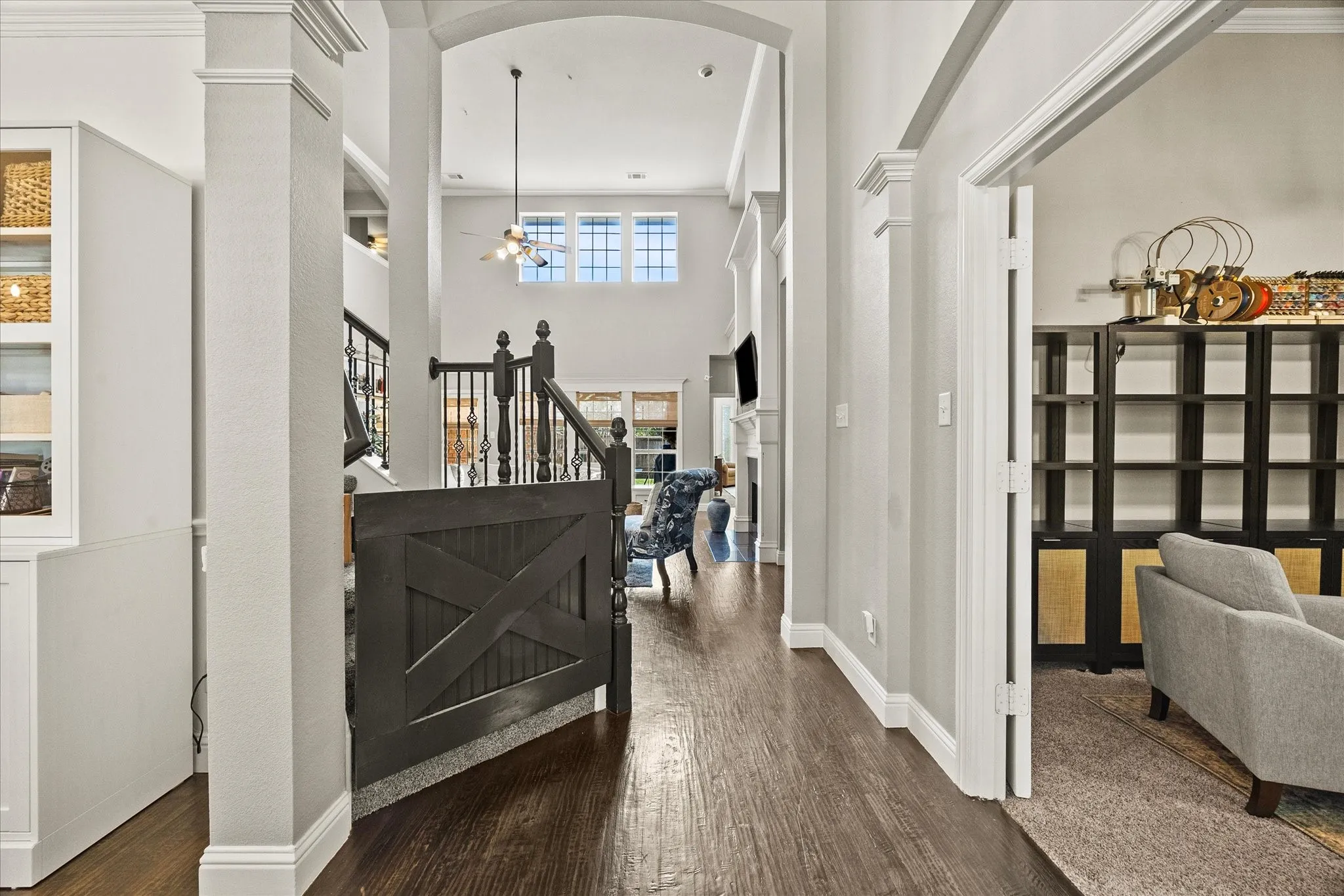 1602 Mapleleaf Drive Wylie, TX 75098 Engineered Wood-finish flooring throughout, custom built-in cabinetry, elegant archways, and a staircase with decorative balusters