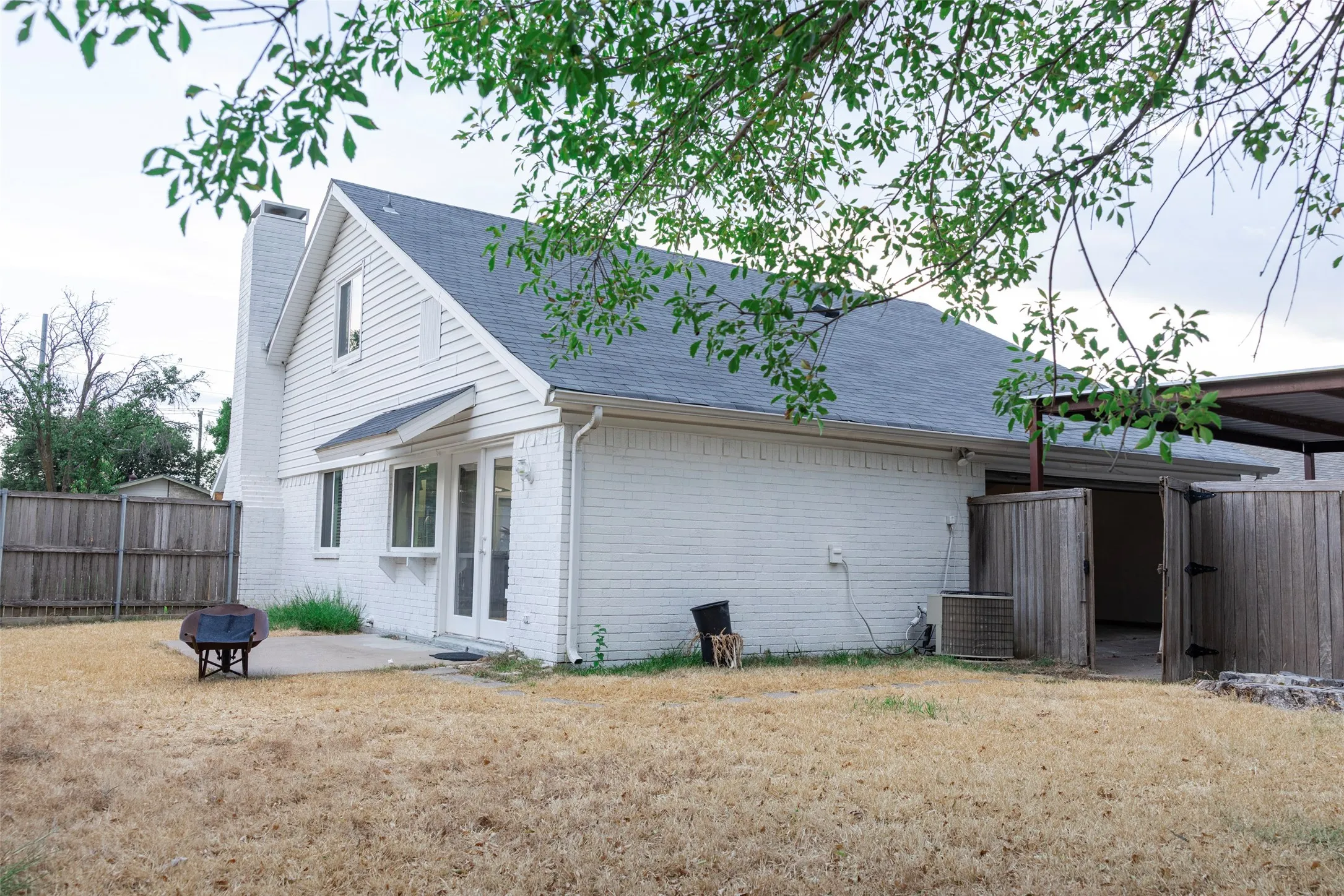 White brick exterior with a contrasting dark roof