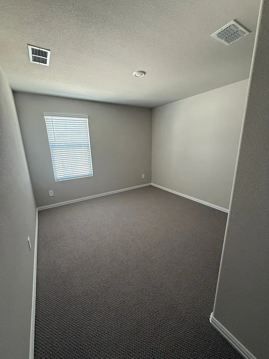 Wall-to-wall carpeting, window with blinds, recessed ceiling lighting, and light gray wall paint