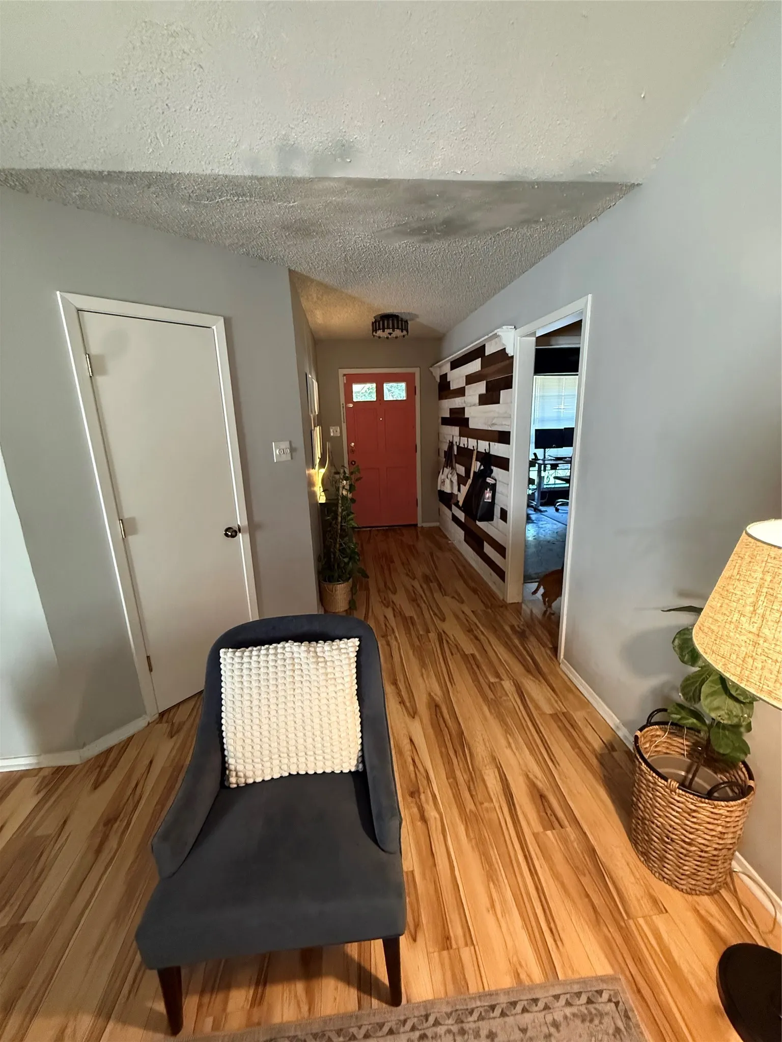 Wood-finish flooring throughout the hallway