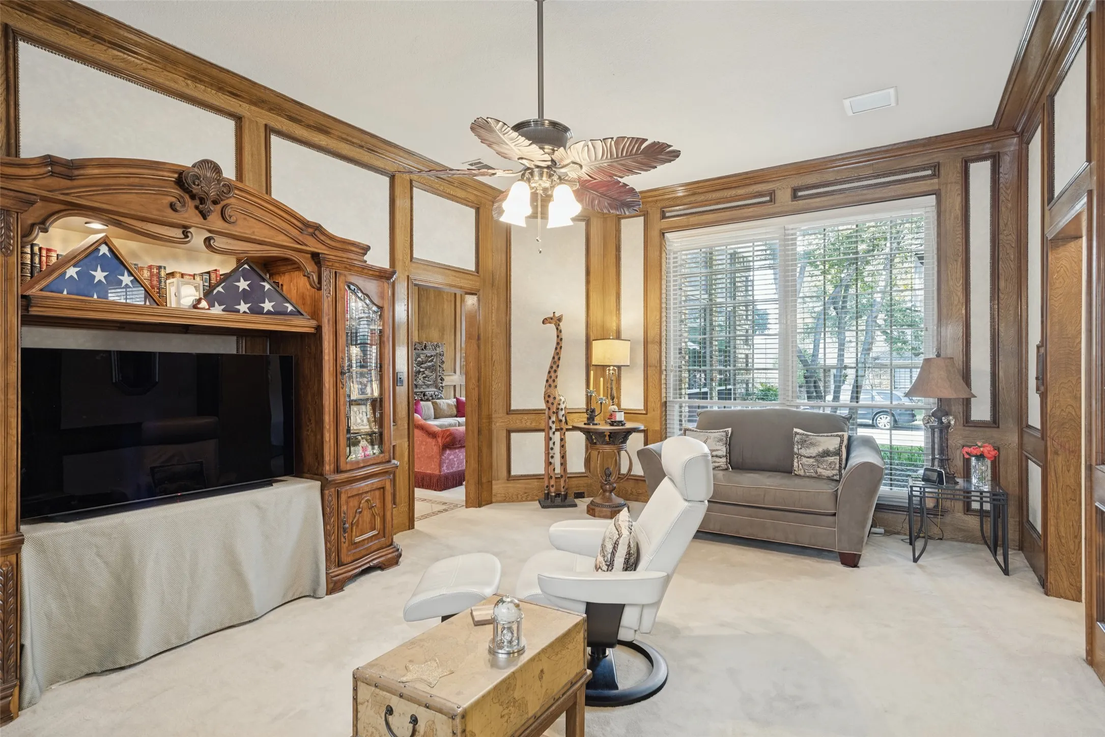 Detailed wood paneling, ceiling fan with light fixture, and recessed lighting