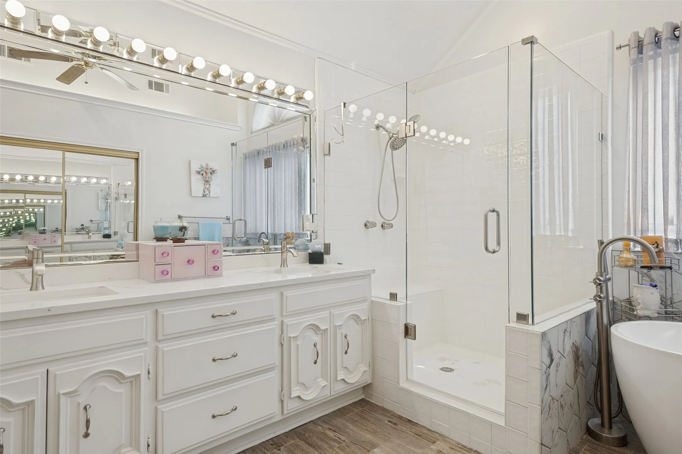 Double vanity with undermount sinks and white cabinetry