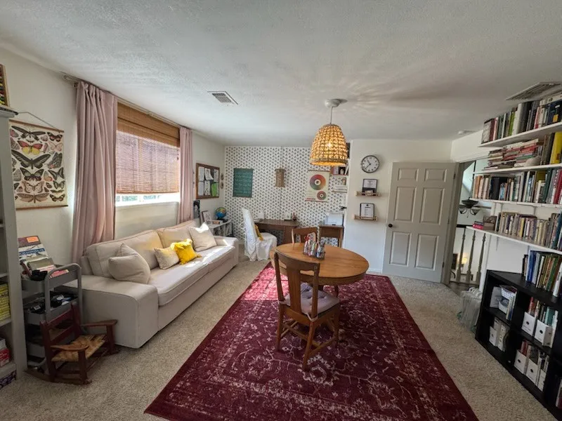 Large upstairs bedroom currently being used as a study/school room.