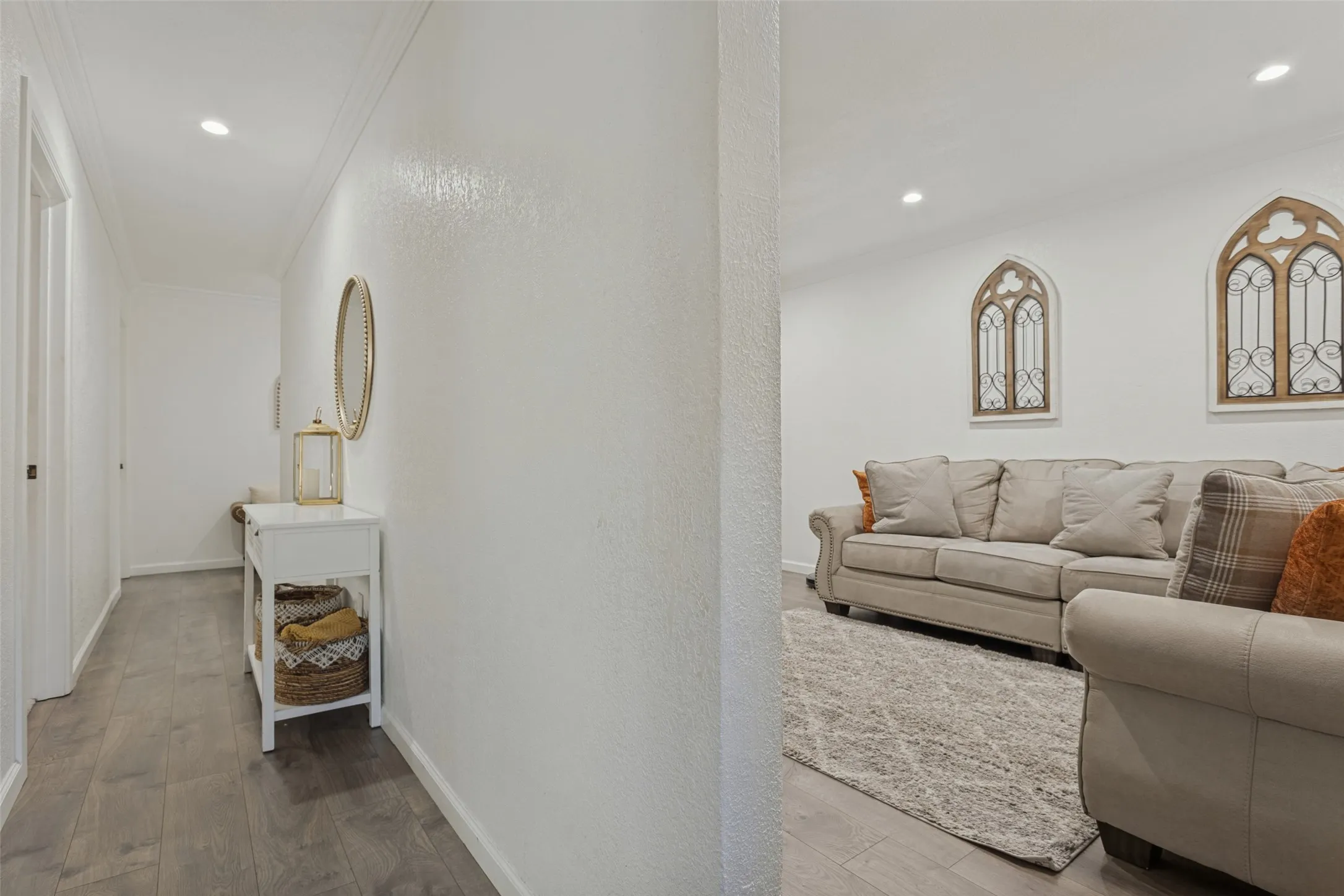 Neutral interior space featuring wood-finish flooring, recessed lighting, and crown molding
