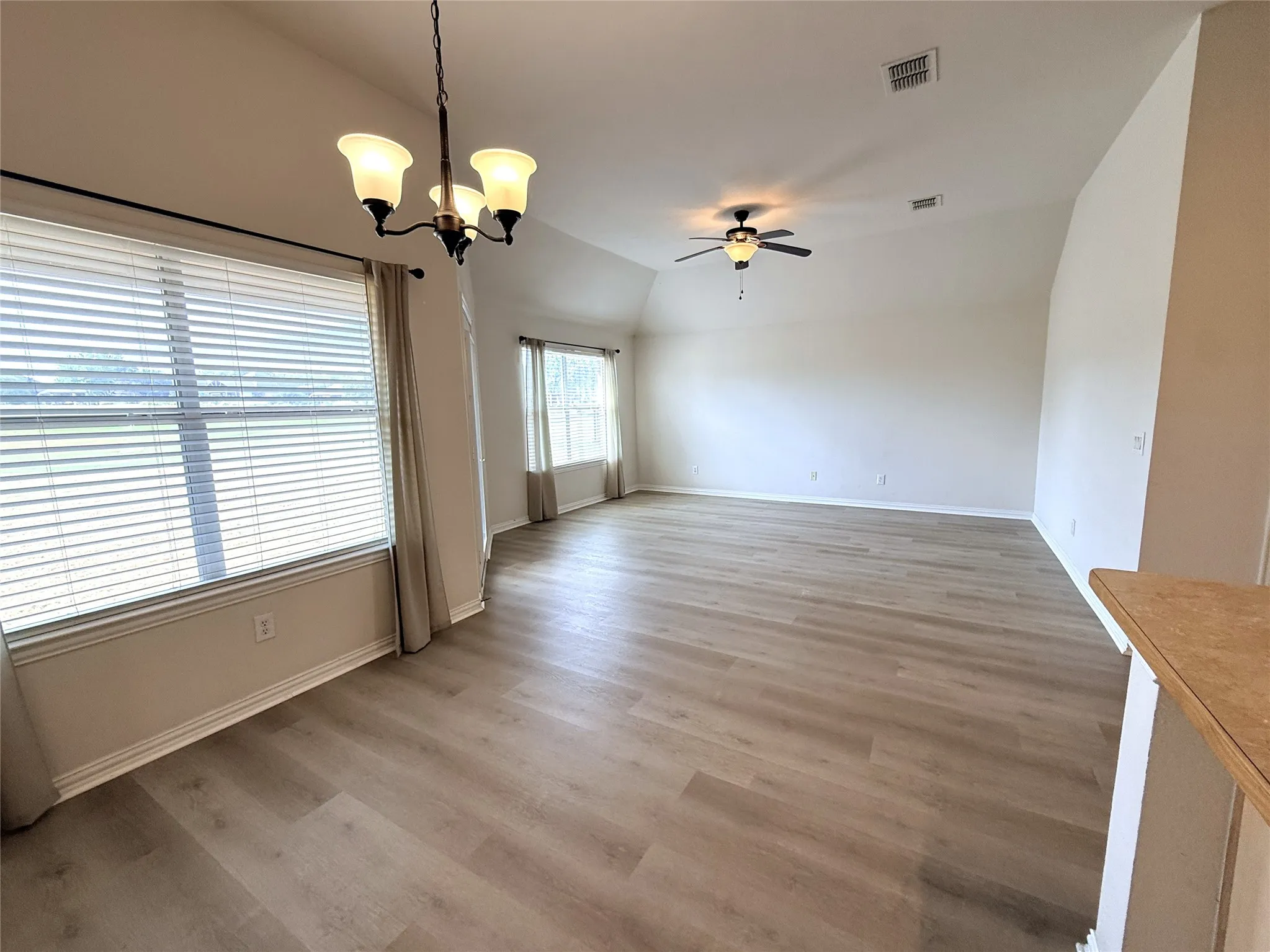 Dining and living area with views of golf course