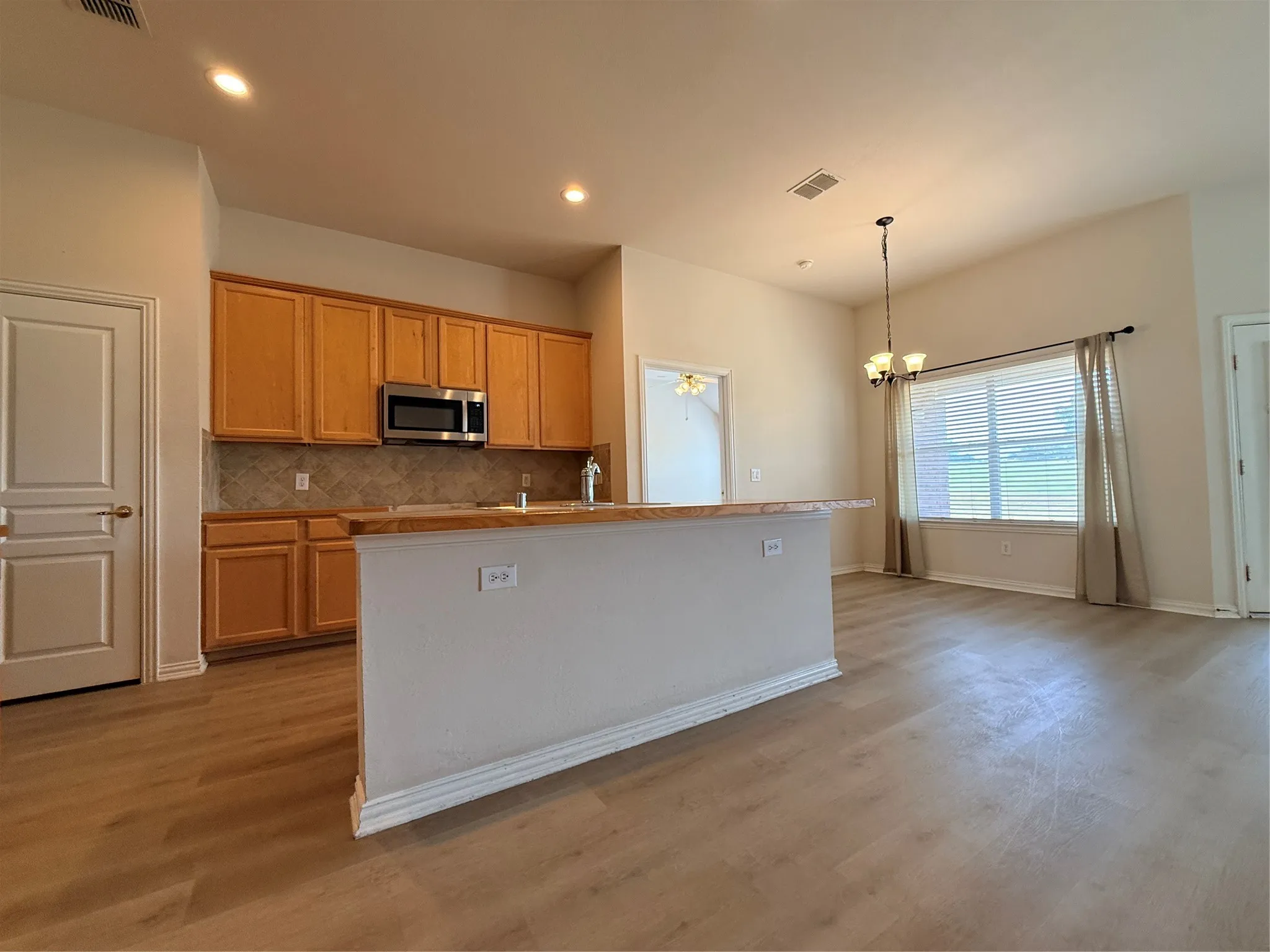 kitchen is very open.  SS appliances, 42 inch maple cabinets