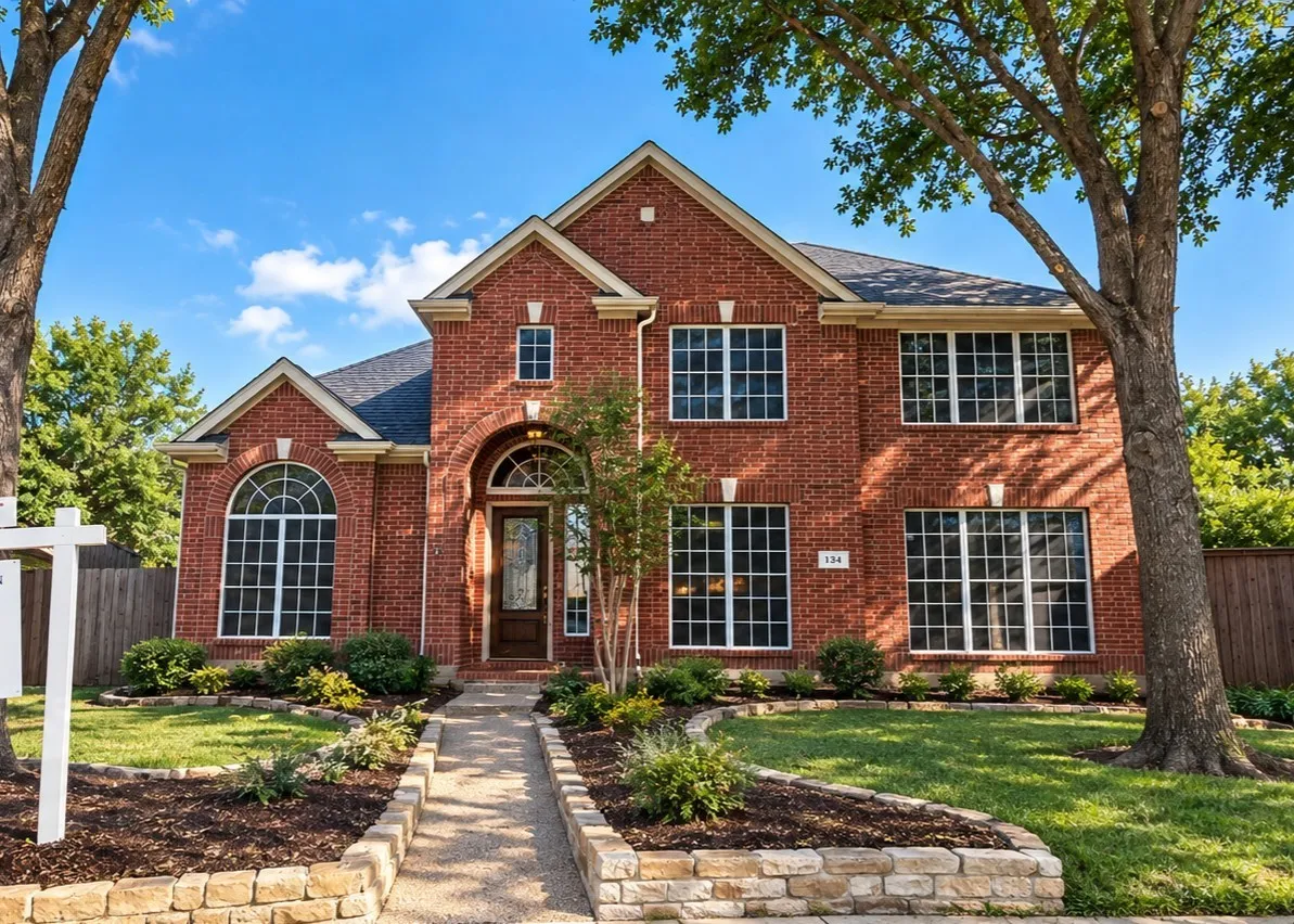 Brick exterior with a gabled roof and arched entry