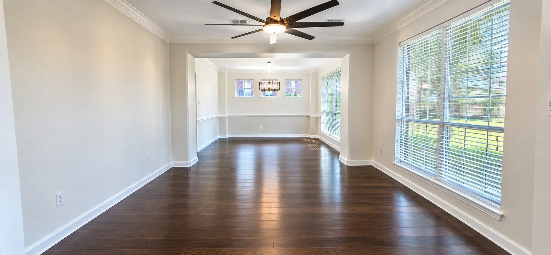 stacked living and dining room with ample light