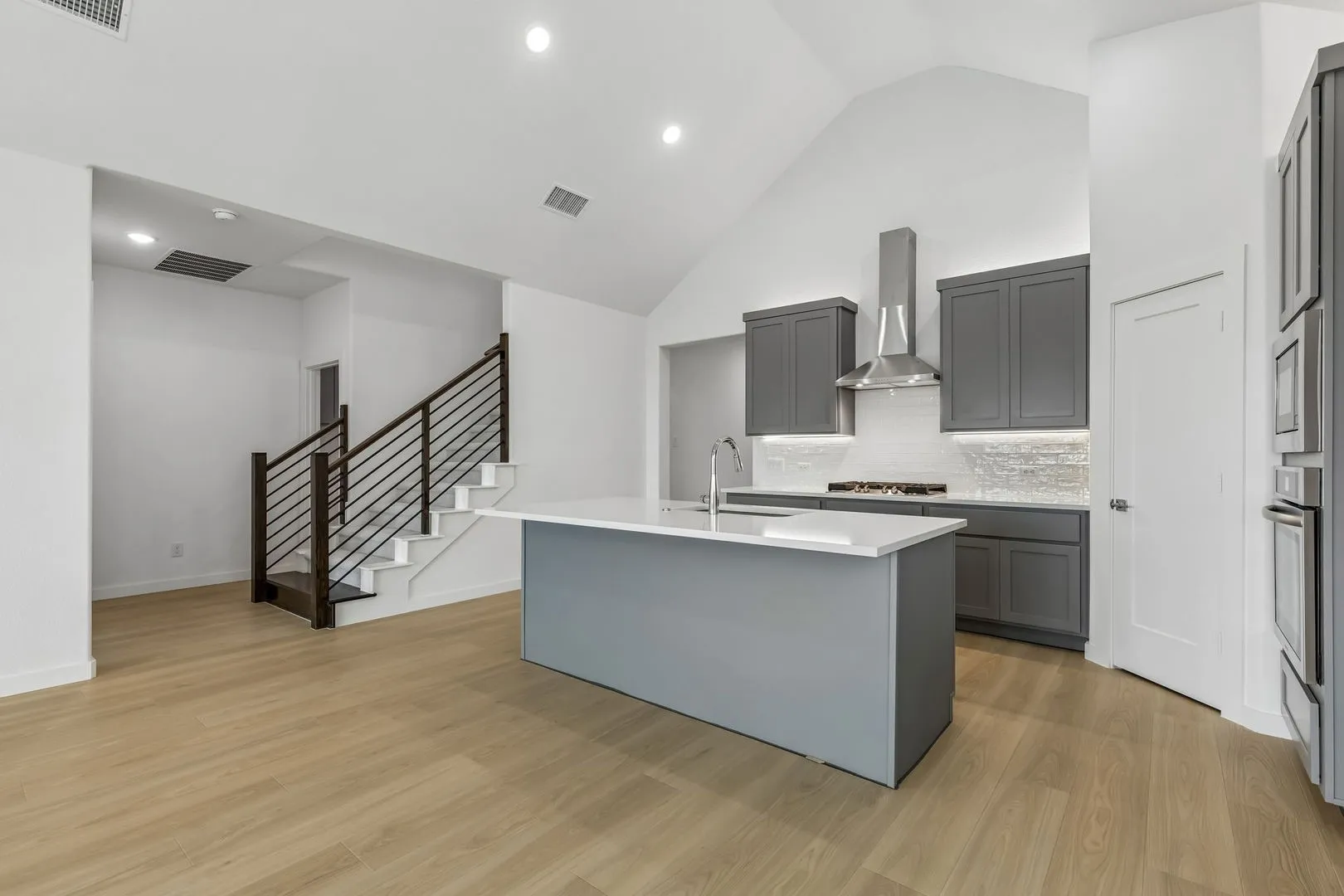 Kitchen in the Claret home plan by Trophy Signature Homes – REPRESENTATIVE PHOTO