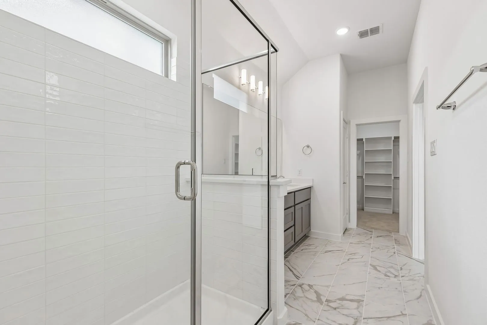 Primary Bathroom in the Claret home plan by Trophy Signature Homes – REPRESENTATIVE PHOTO
