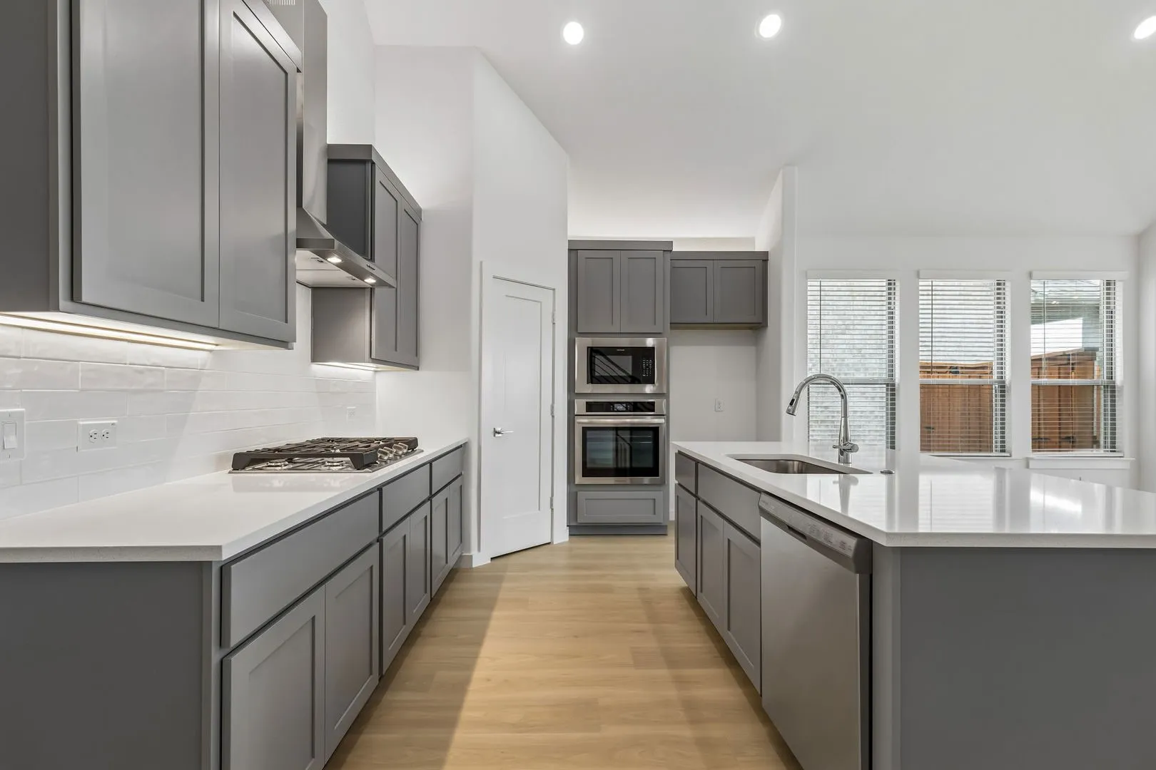 Kitchen in the Claret home plan by Trophy Signature Homes – REPRESENTATIVE PHOTO