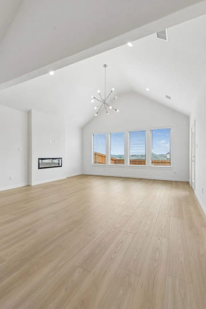 Living Room in the Claret home plan by Trophy Signature Homes – REPRESENTATIVE PHOTO