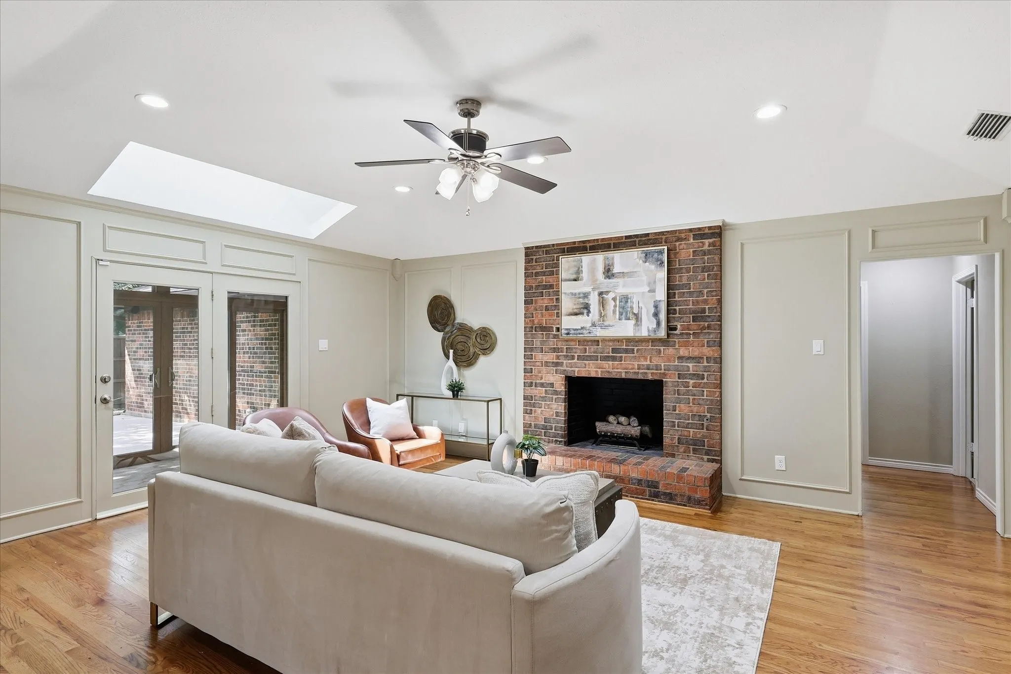 Sunroom Off Living Area with Fireplace & Skylight