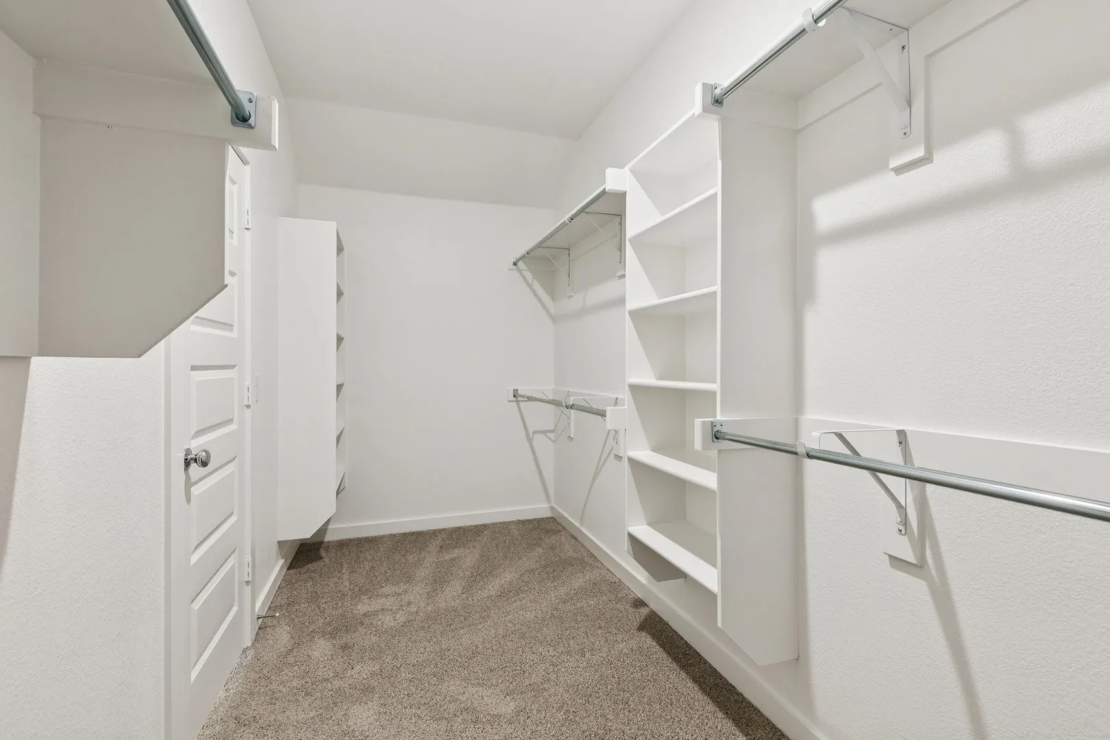 Primary Closet in the Heisman home plan by Trophy Signature Homes – REPRESENTATIVE PHOTO