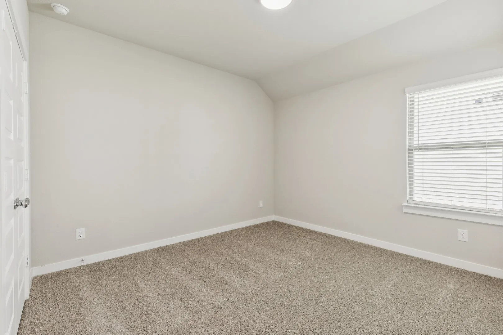 Bedroom in the Heisman home plan by Trophy Signature Homes – REPRESENTATIVE PHOTO