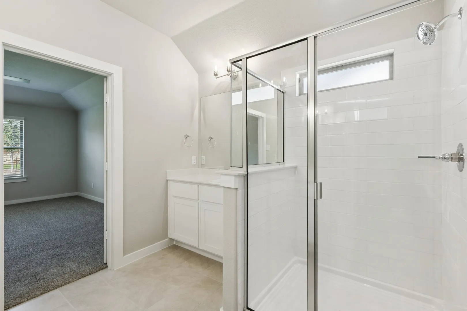 Primary Bathroom in the Heisman home plan by Trophy Signature Homes – REPRESENTATIVE PHOTO