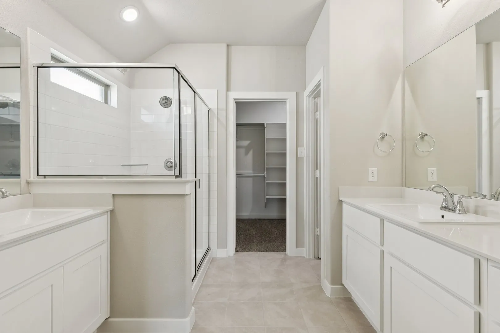 Primary Bathroom in the Heisman home plan by Trophy Signature Homes – REPRESENTATIVE PHOTO