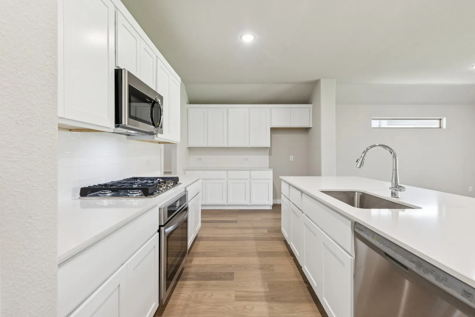 Kitchen in the Heisman home plan by Trophy Signature Homes – REPRESENTATIVE PHOTO