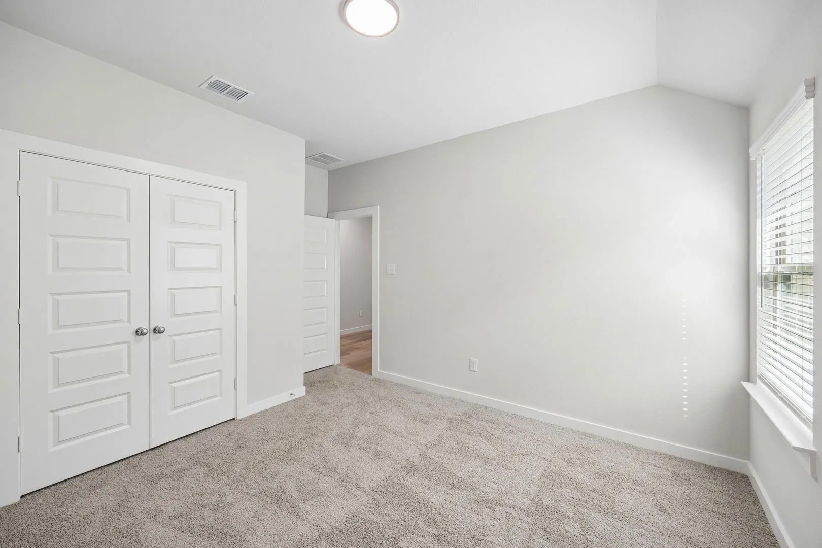 Bedroom in the Oscar home plan by Trophy Signature Homes – REPRESENTATIVE PHOTO
