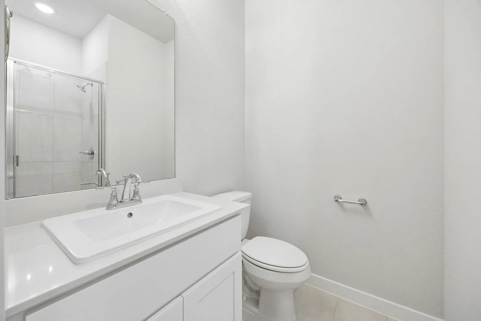 Bathroom in the Oscar home plan by Trophy Signature Homes – REPRESENTATIVE PHOTO