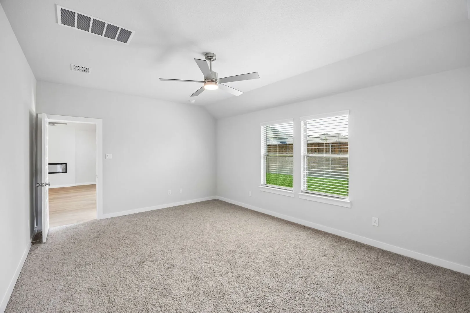 Primary Suite in the Oscar home plan by Trophy Signature Homes – REPRESENTATIVE PHOTO