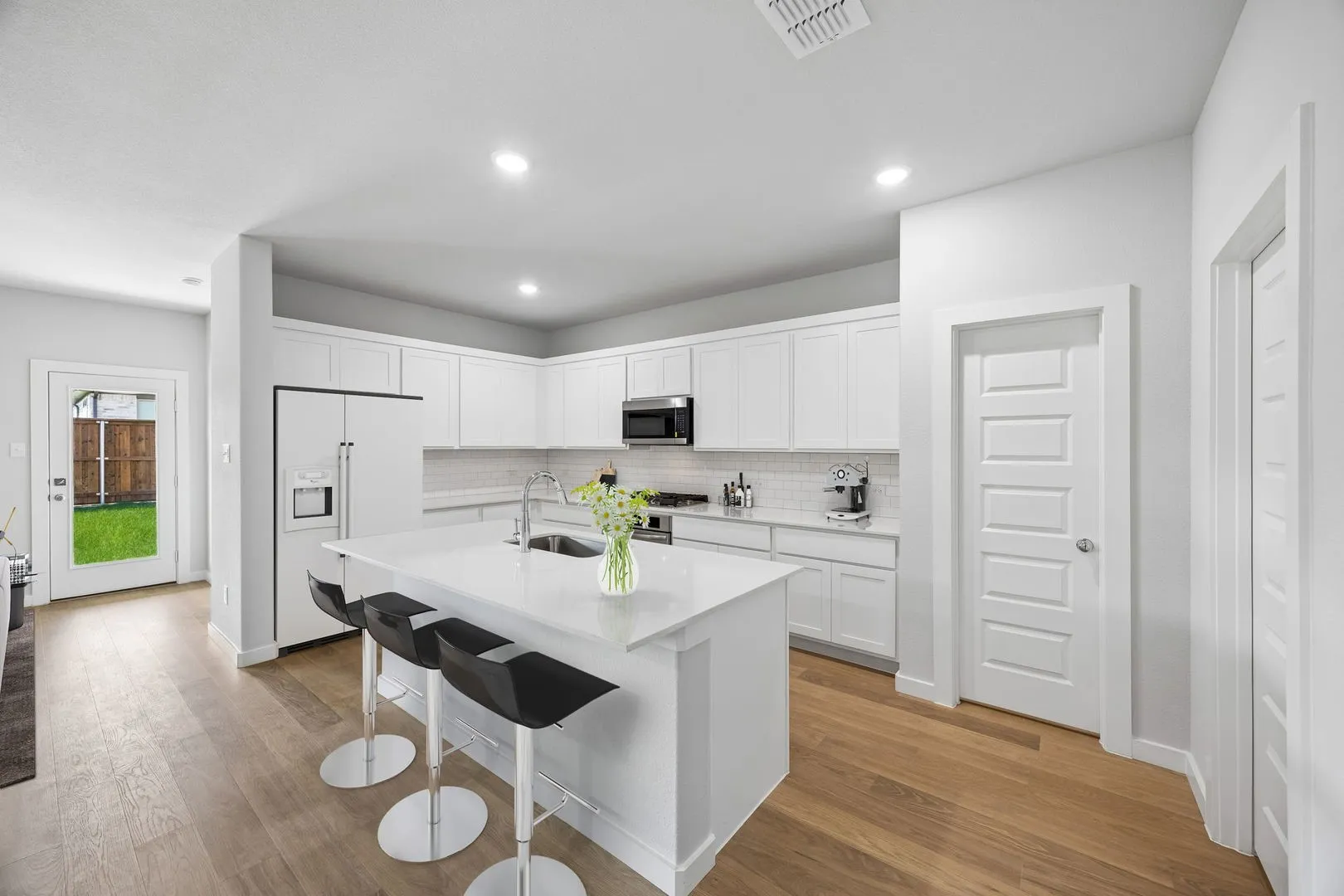 Kitchen in the Oscar home plan by Trophy Signature Homes – REPRESENTATIVE PHOTO