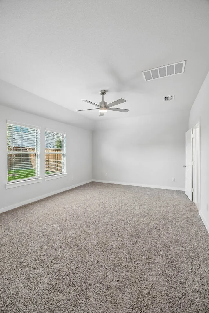 Primary Suite in the Oscar home plan by Trophy Signature Homes – REPRESENTATIVE PHOTO