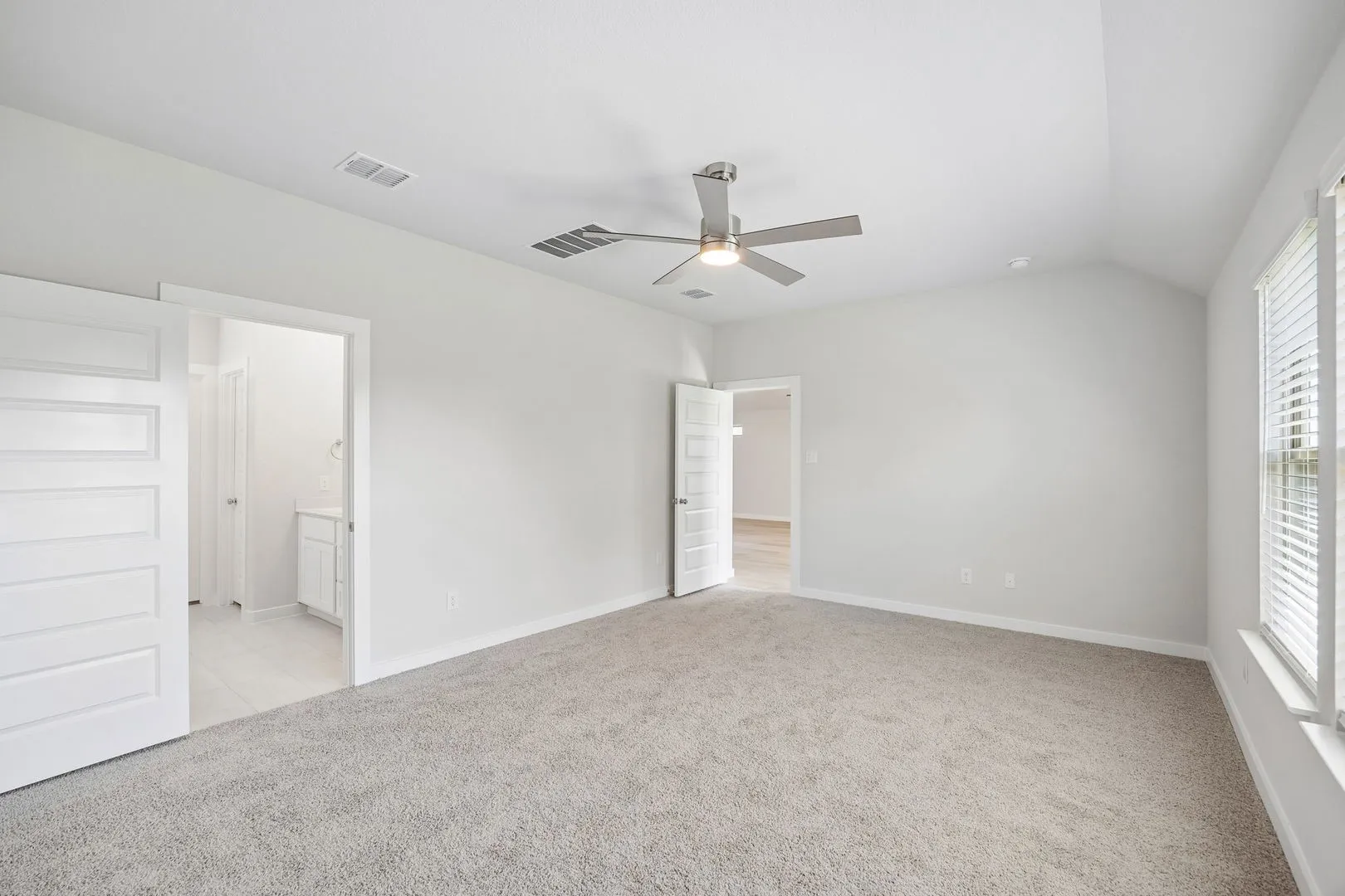 Primary Suite in the Oscar home plan by Trophy Signature Homes – REPRESENTATIVE PHOTO