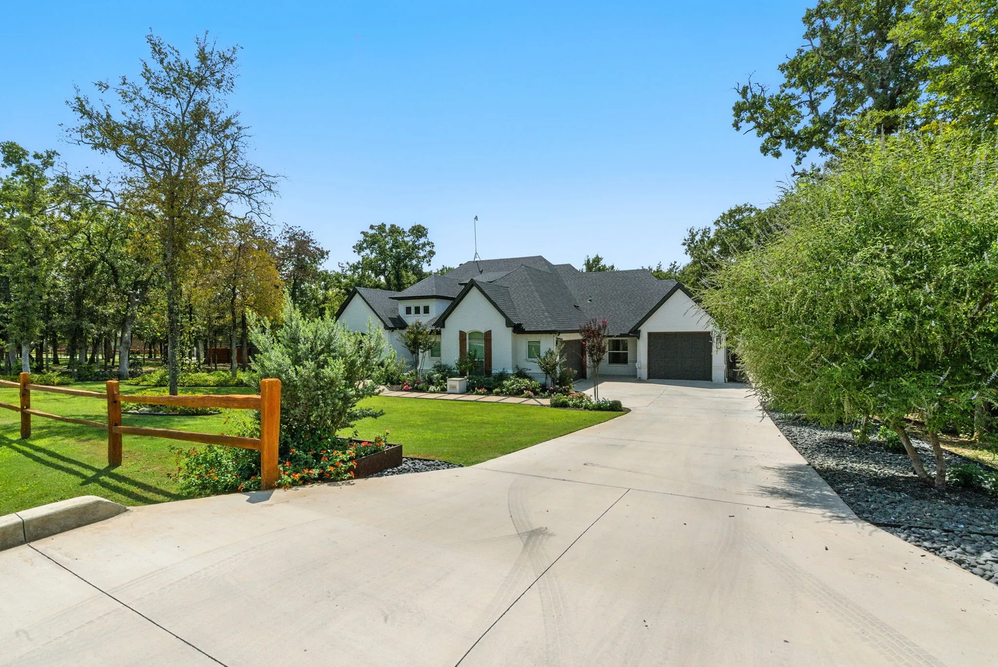 White exterior with dark trim and a dark roof
