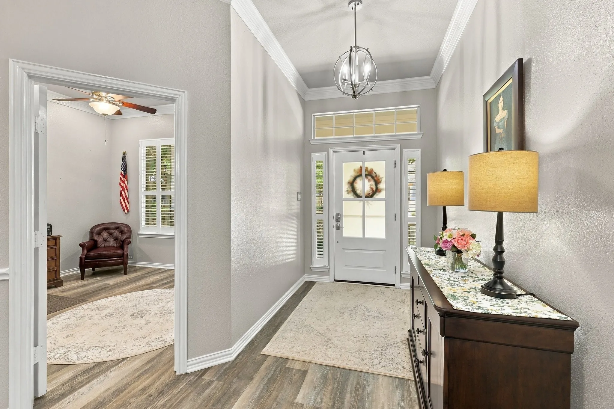 Inviting foyer with office on one side