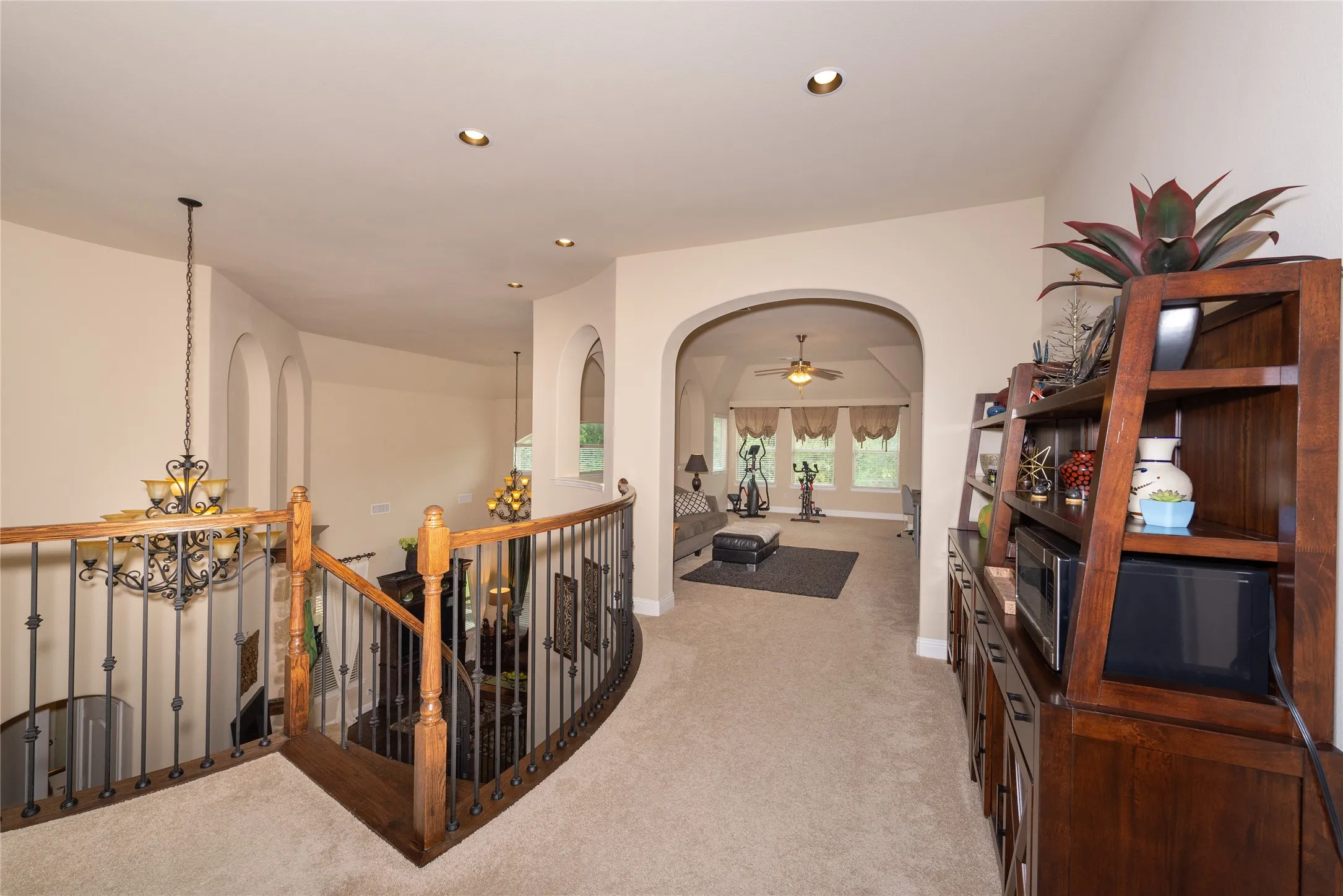 Carpeted landing with recessed lighting