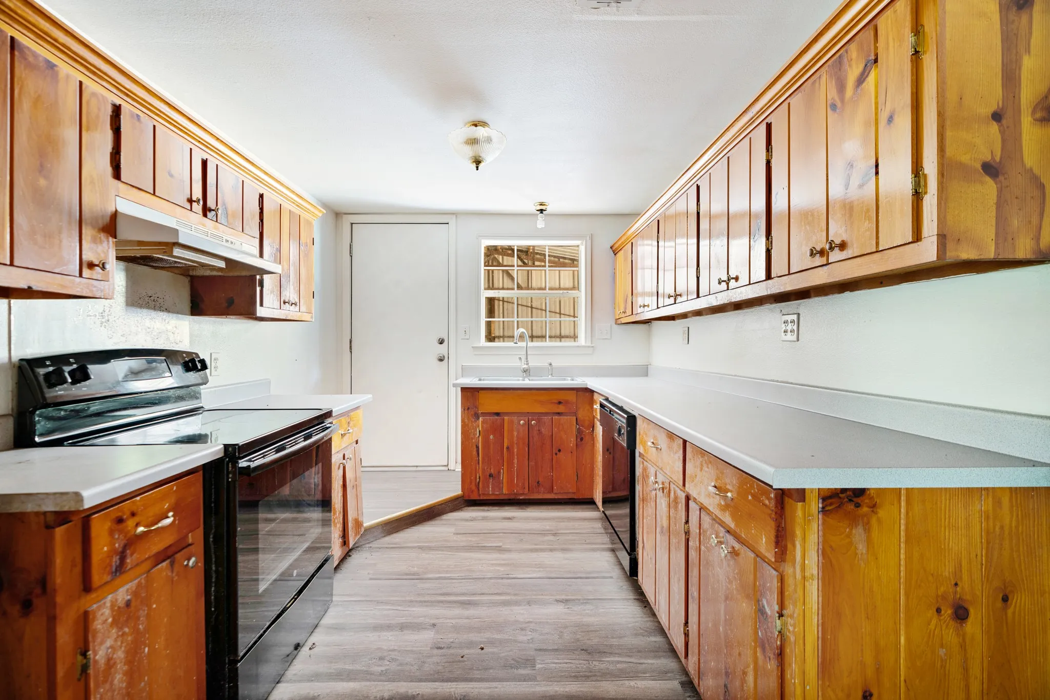 Additional kitchen view highlights generous storage and counter space