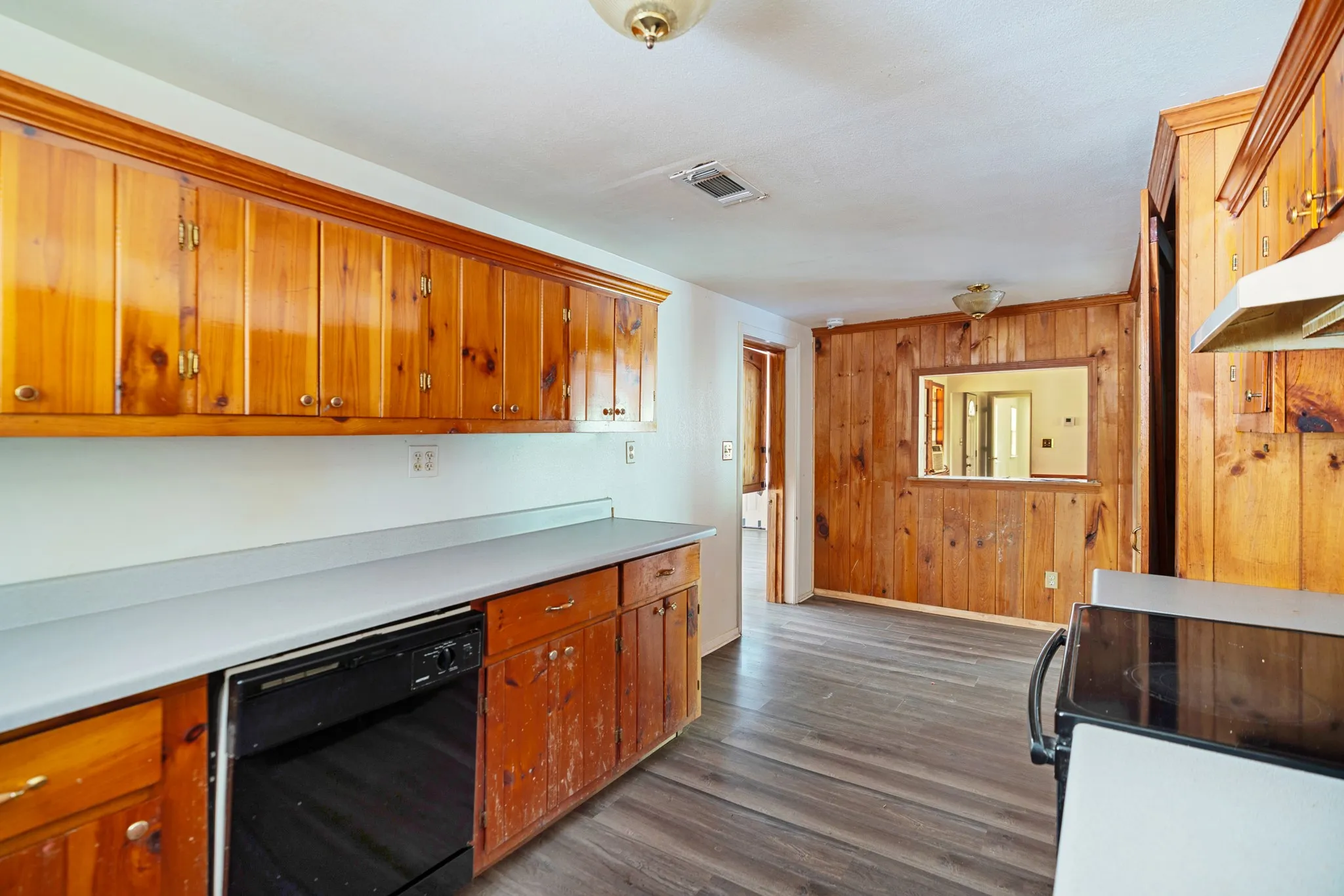 Spacious kitchen with abundant cabinetry and work surfaces