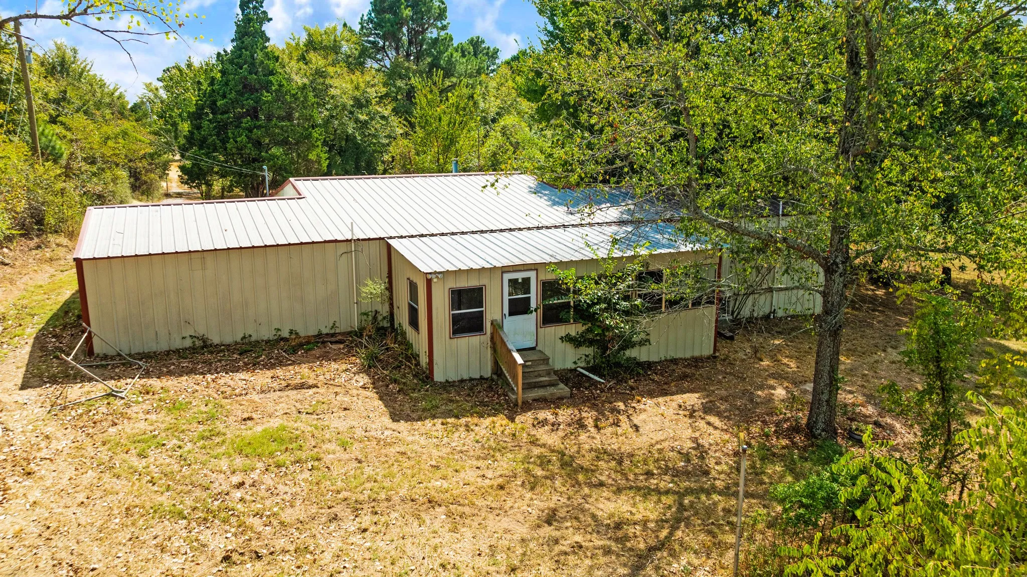 Rear exterior view of house showcasing sunroom