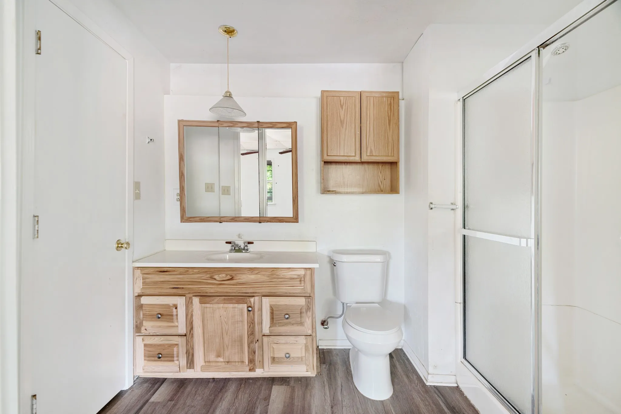 Full primary ensuite bath with vanity storage and tub-