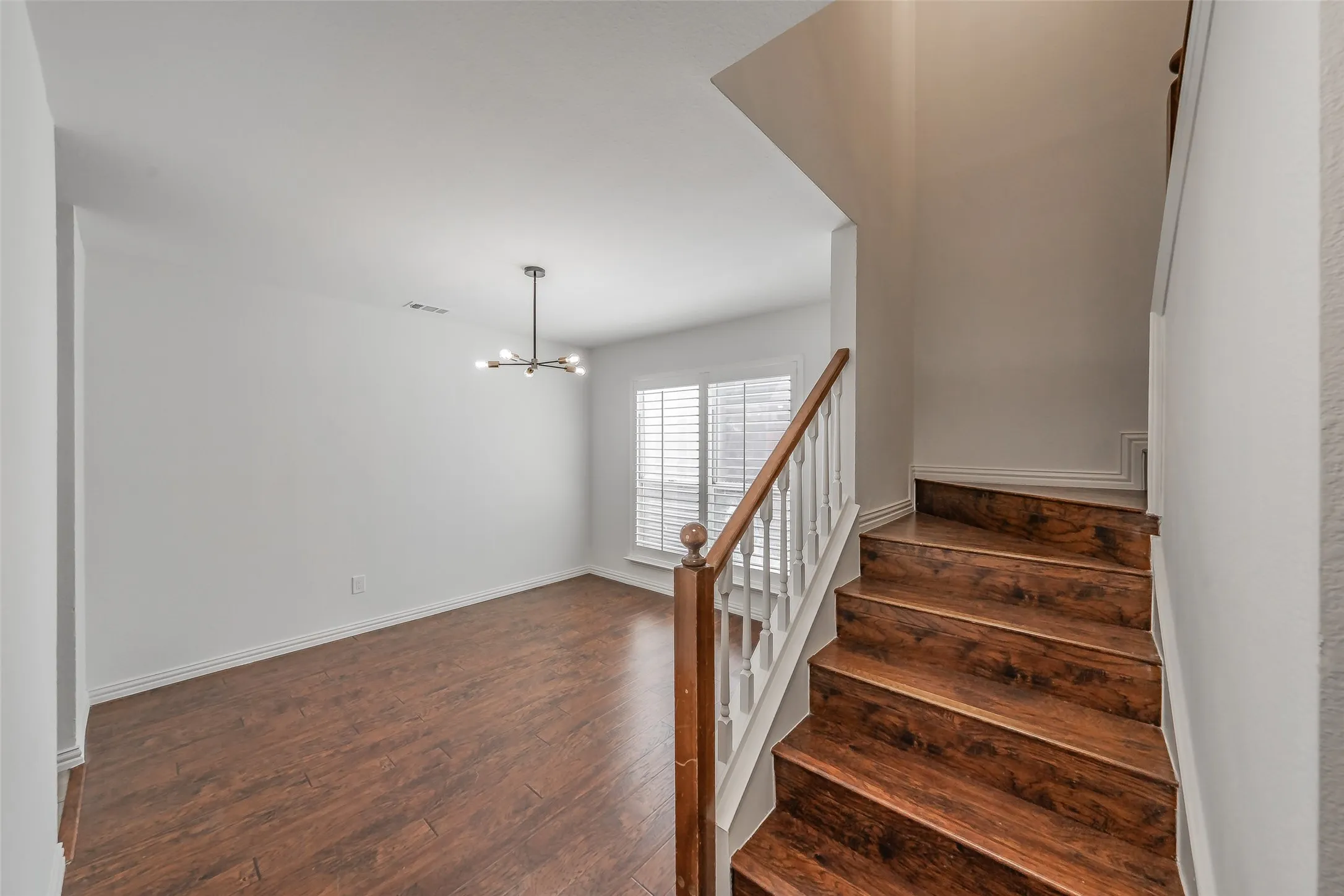 Formal dining area and staircase leading to second floor