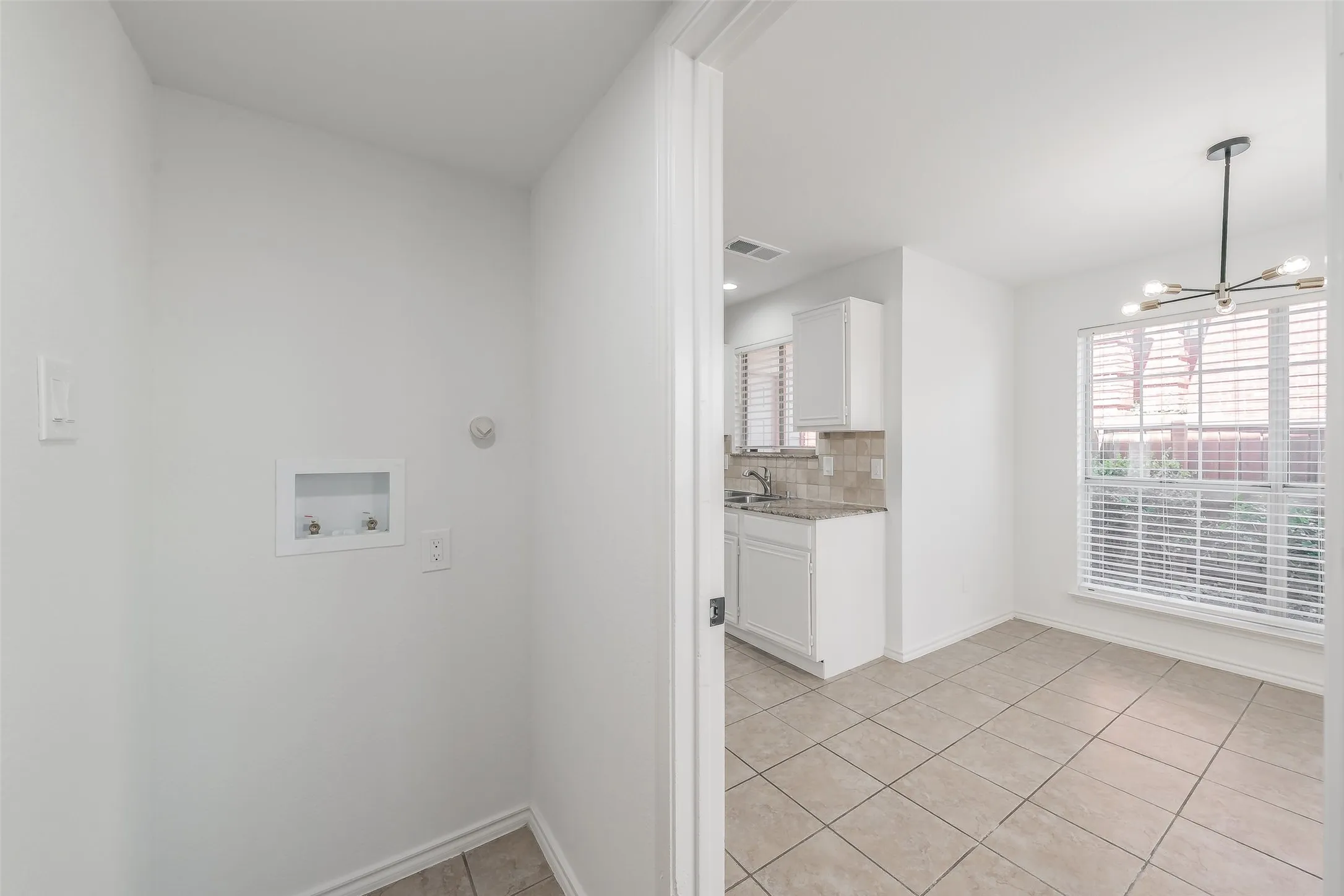 full size washer and dryer hookups between kitchen and garage