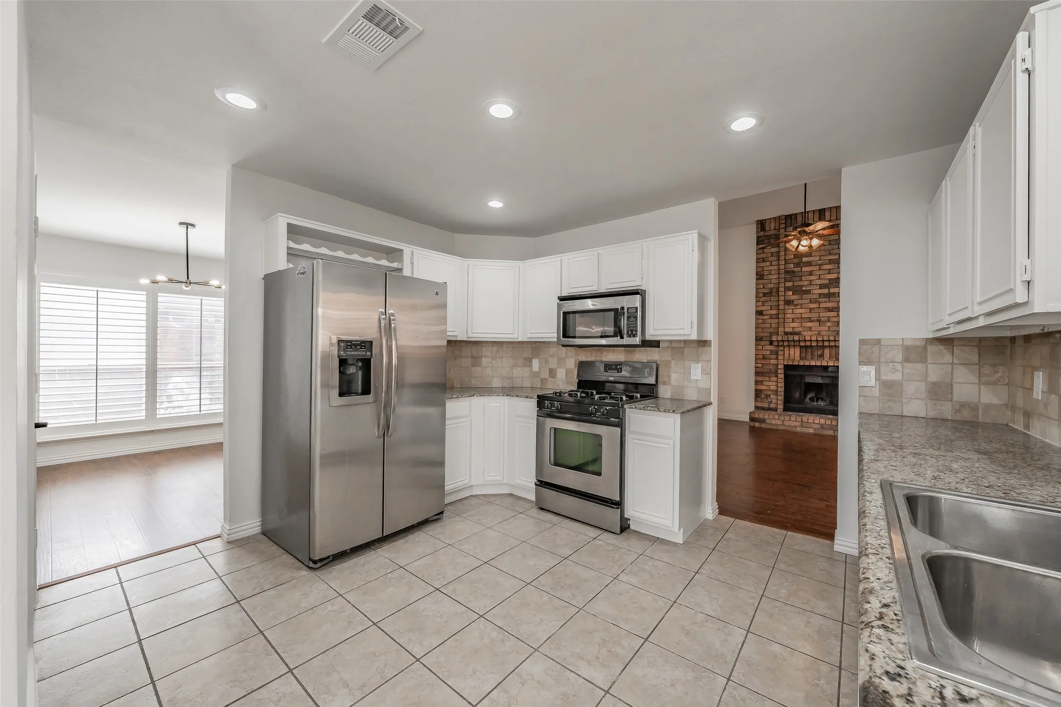 Kitchen conveniently located near breakfast nook and utility leading to the garage
