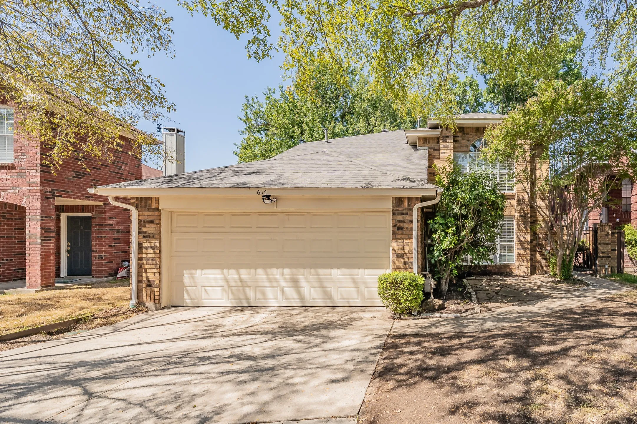 Brick exterior with a two-car garage