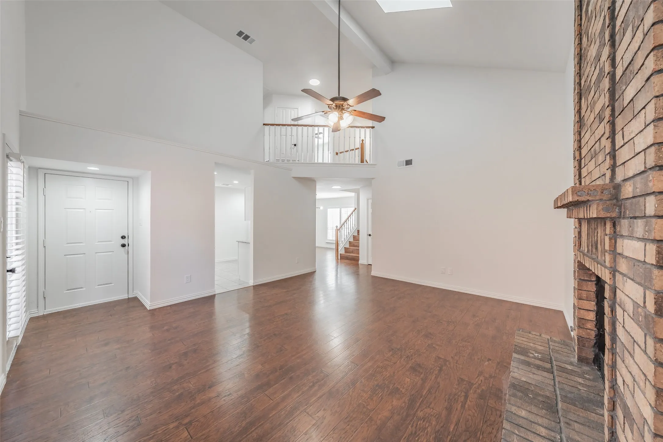 Vaulted ceilings, wood flooring in the living room