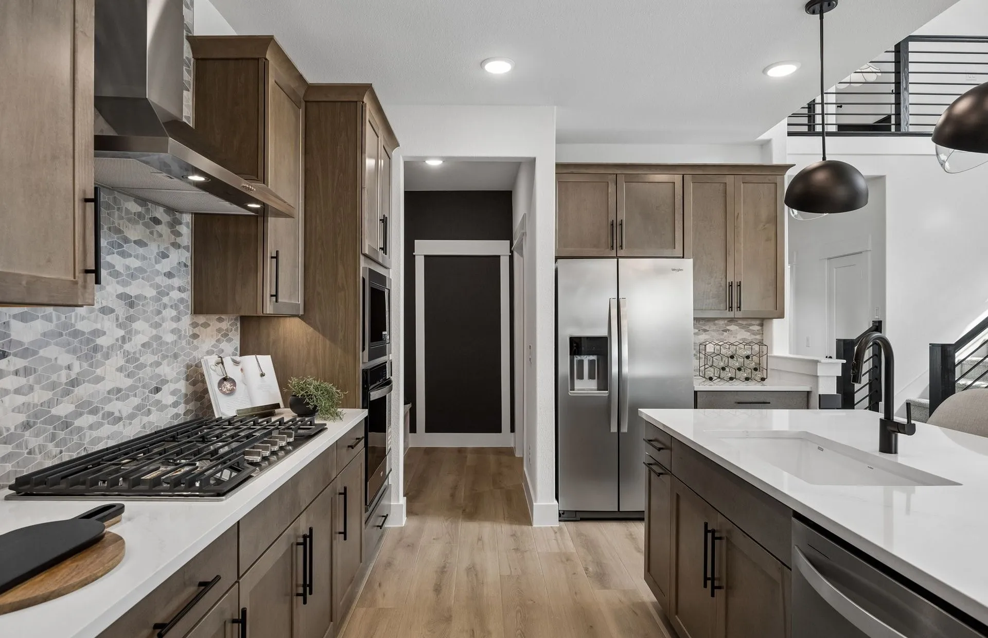 *Model Representation - Large island overlooking gathering room and dining areas