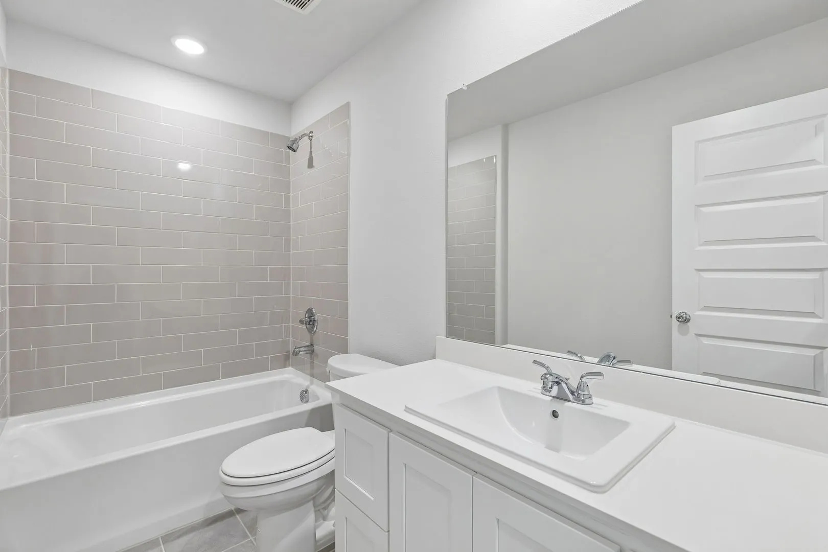 Bathroom in the Harrison home plan by Trophy Signature Homes – REPRESENTATIVE PHOTO