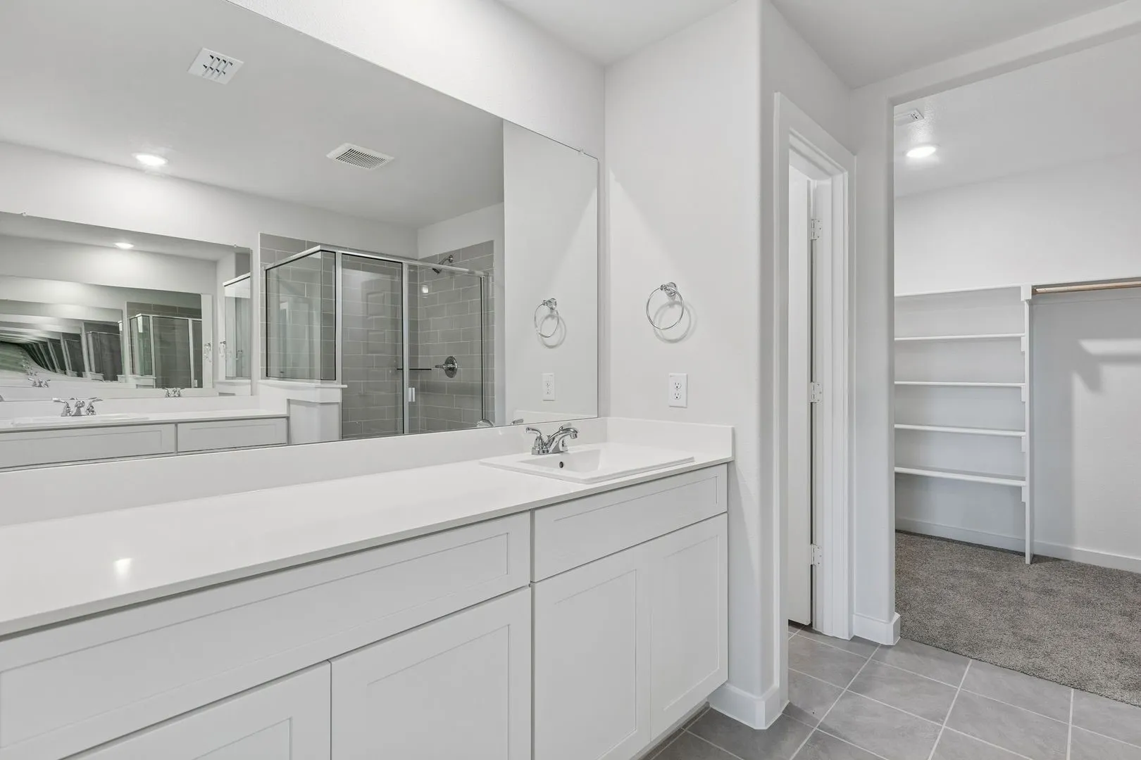 Primary Bathroom in the Harrison home plan by Trophy Signature Homes – REPRESENTATIVE PHOTO