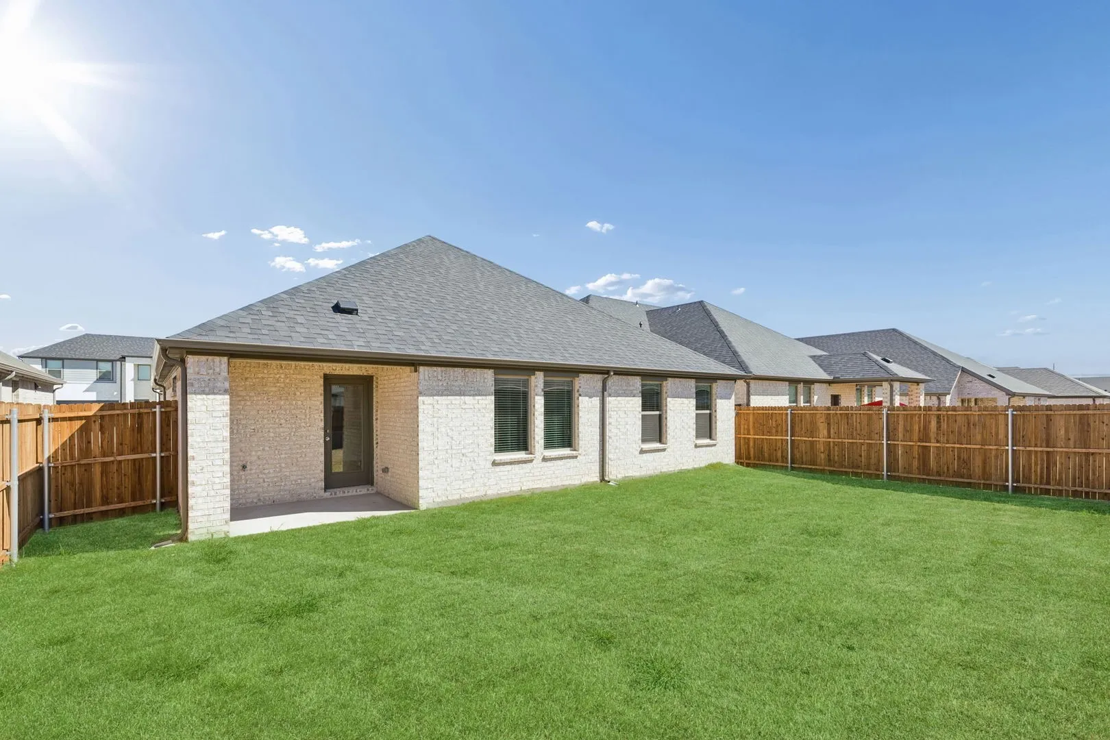 Covered Patio in the Harrison home plan by Trophy Signature Homes – REPRESENTATIVE PHOTO