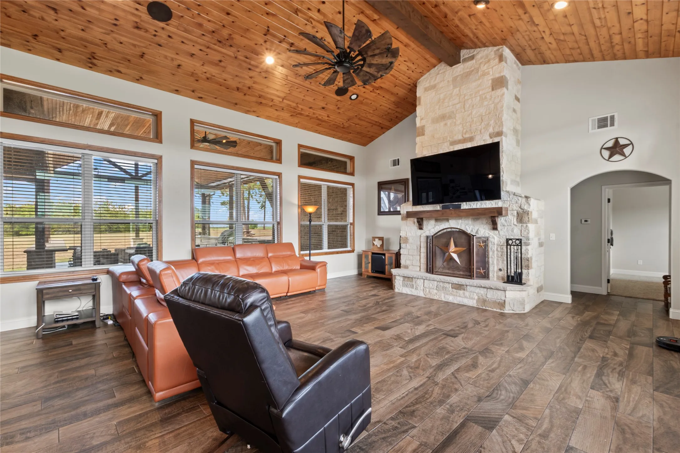 Living room with stone fireplace