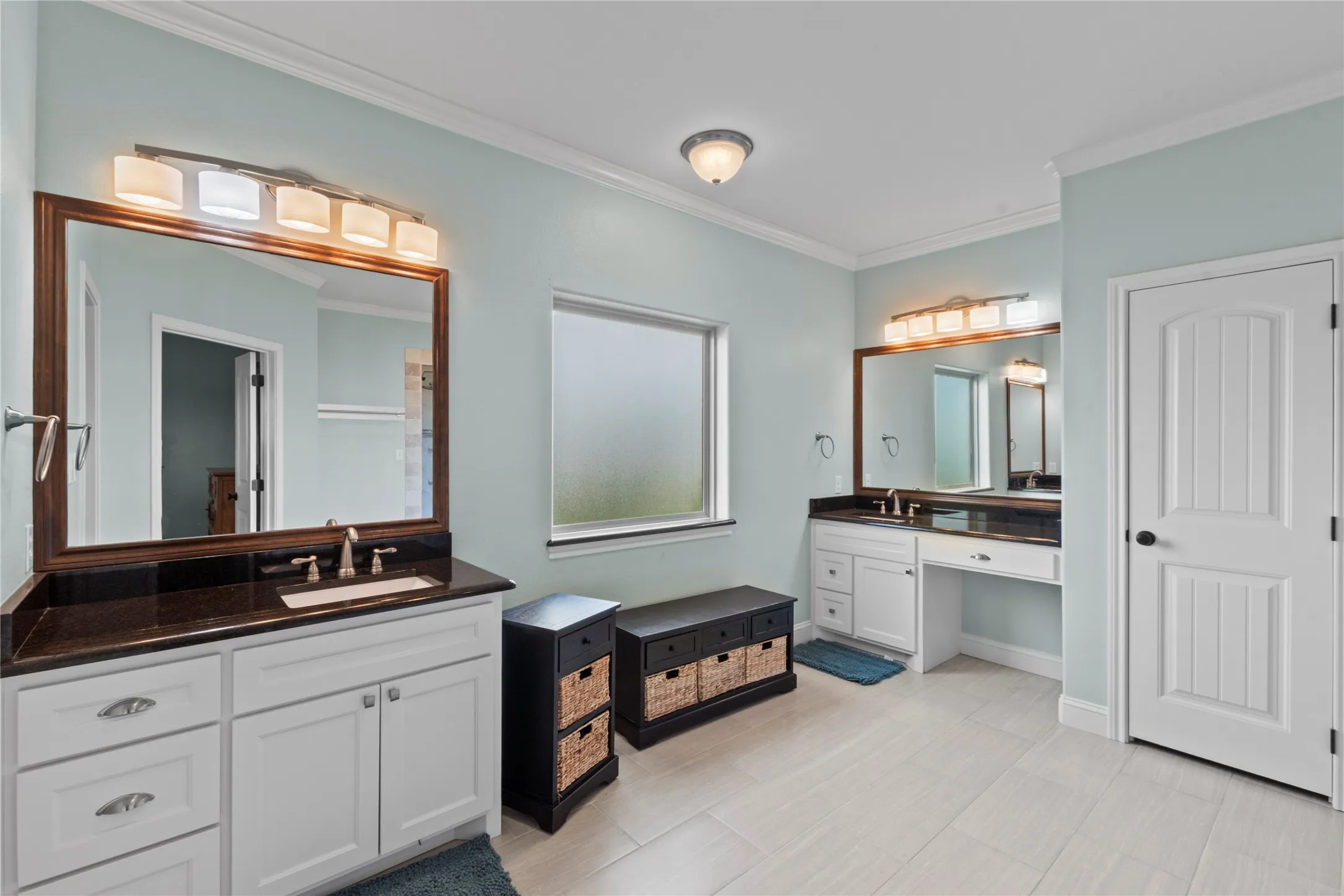 primary bathroom with 2 walk in closets