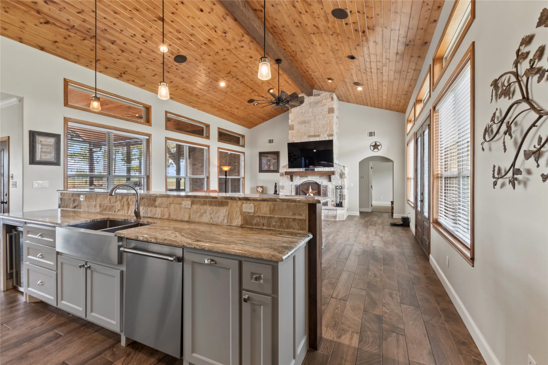 Kitchen with bar seating open to living room